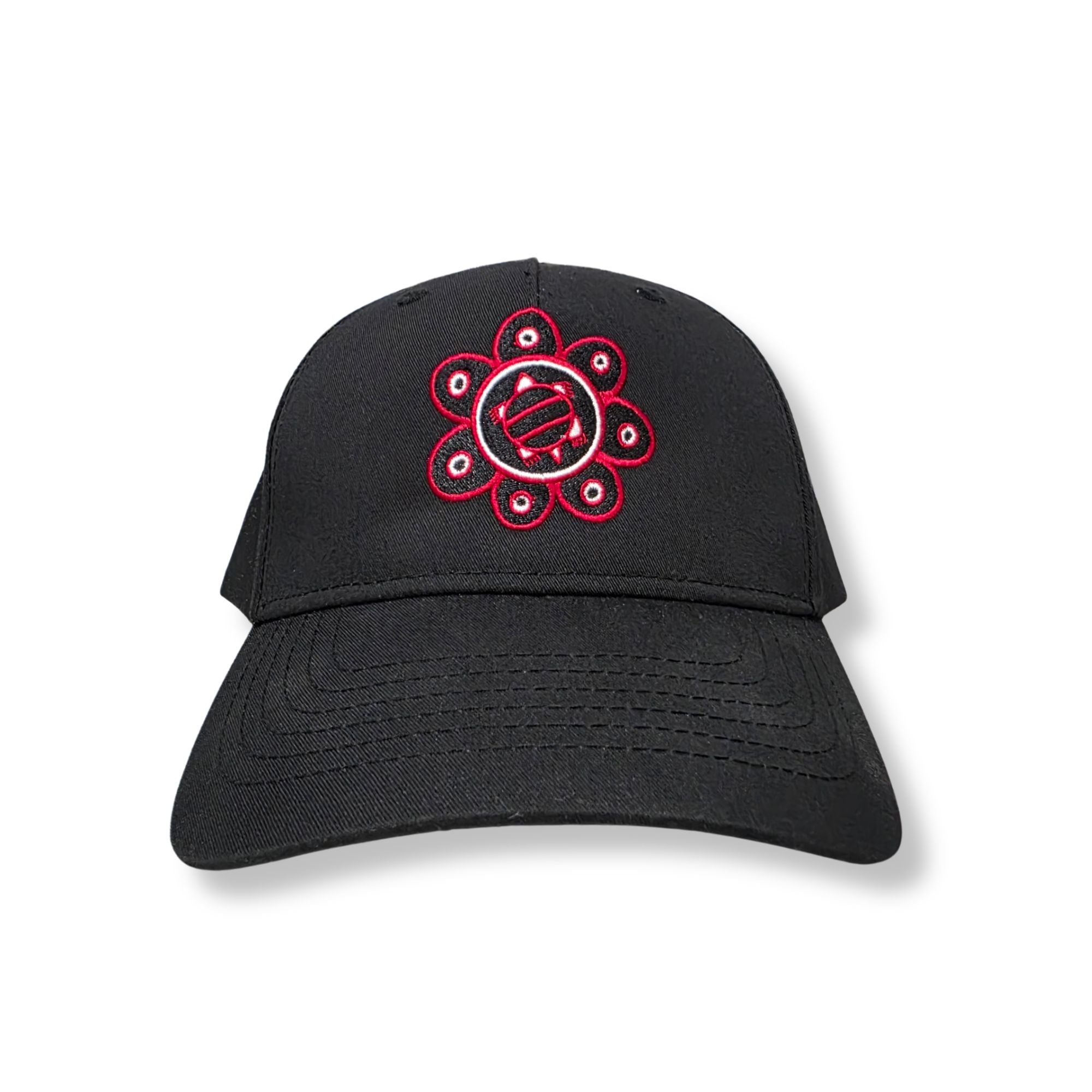 A black baseball cap featuring a red and white embroidered circular floral graphic on the front, set against a plain white background.