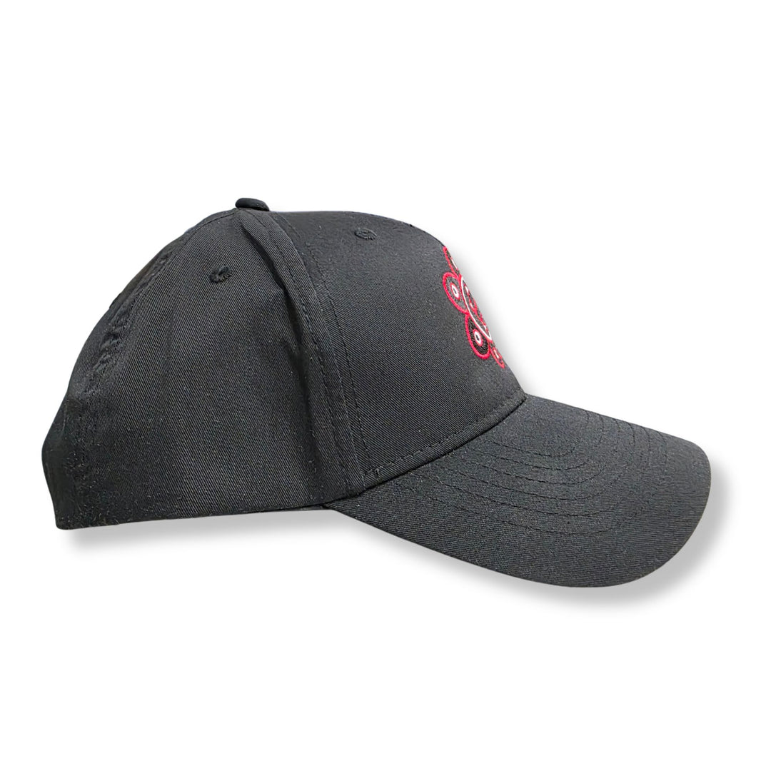 Black cap with perforated design on a white background